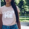 Girl is wearing t-shirt with a text " I love me"