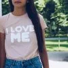 Girl is wearing t-shirt with a text " I love me"